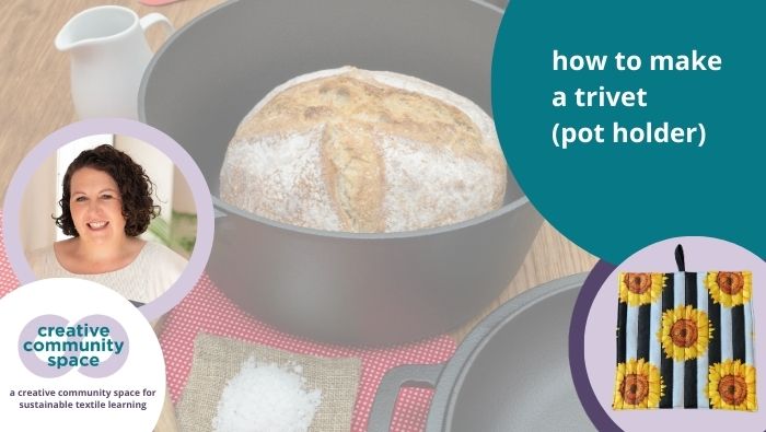 a loaf of bread in a pot sitting on top of a trivet